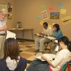 Hesston College professor Al Yoder explains a point during an ESL (English as a Second Language) course during the spring semester. Yoder is retiring from the college at the end of the present school year in early May.