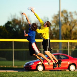 Hesston College sophomore Kyle Vogt, Harper, Kan., makes the catch as Tabor College freshman Jacob Heil, Wichita, Kan., defends.