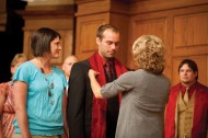 Faculty member Luann Yutzy places a stole on the shoulders of Pastoral Ministries graduate Dan Coburn of Accident, Md.