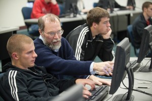 Computer faculty member Bob Harder works with a student