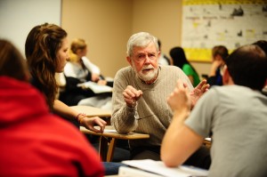 Dr. Robert Enns joins in a small group discussion with some of his Introduction to Sociology students.