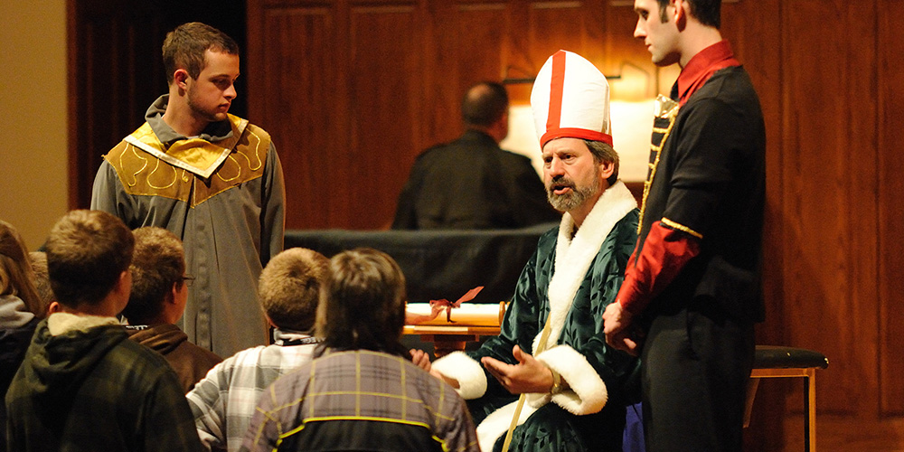 Faculty member John Sharp plays a leader of the state church during the Anabaptist Game, along with students Joel Murray of and Tyler Jones.