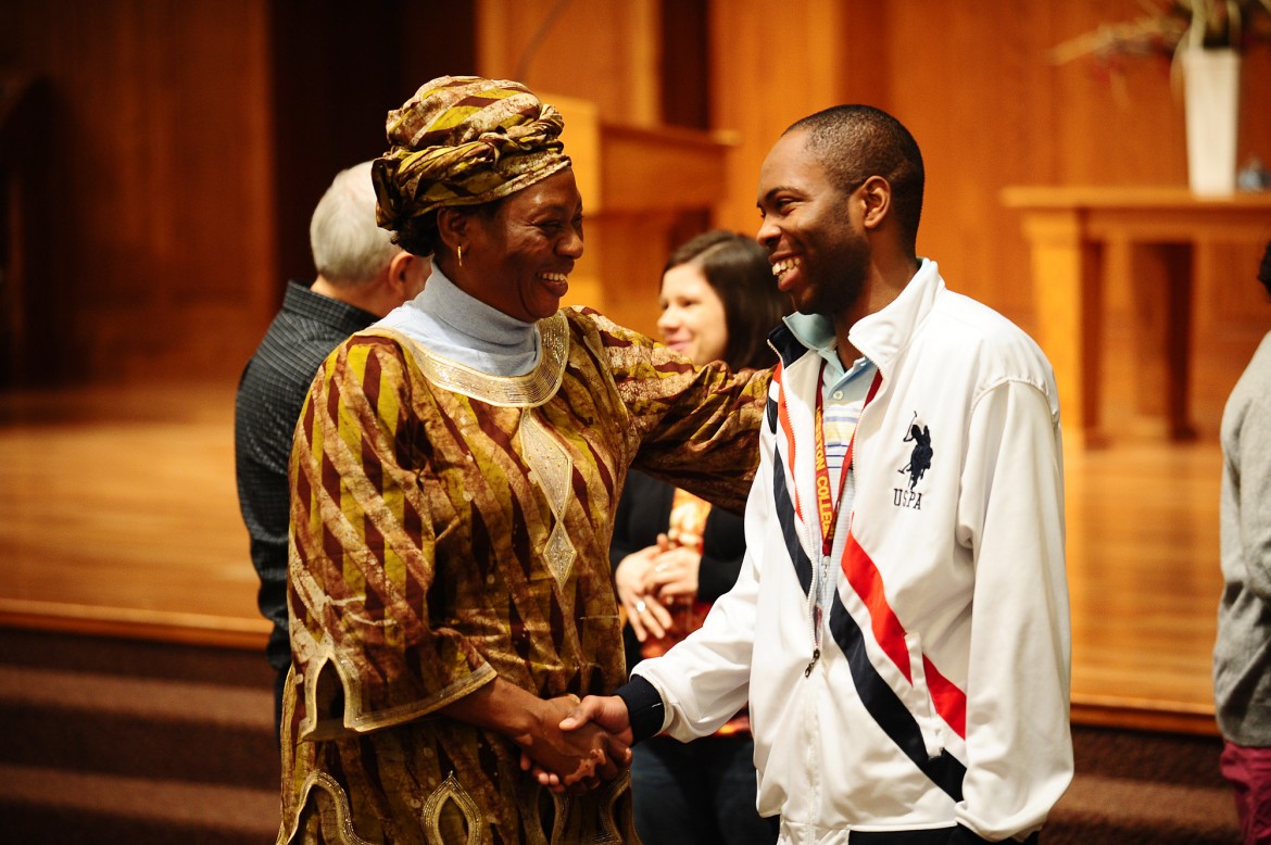 Serge Kalambay Nsunzu (right), a Hesston College freshman from Kinshasa, the Democratic Republic of Congo, talks with Mawangu Cisca Ibanda, a Mennonite World Conference delegate from the Congo following a Hesston College chapel presentation Feb. 23.