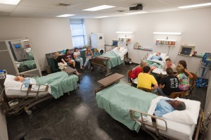 Hesston College students in the new Newton Medical Center Simulation Lab in Kremer Hall