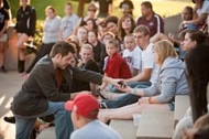 Cheritt Gingerich ’00 performs a magic show during the Friday evening Tailgate Picnic and Family Festival.