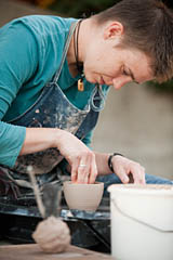 Art faculty member Hanna Eastin throws a teacup during a ceramics demonstration.