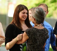 Heidi Zehr of Tiskilwa, Ill., receives a hug and encouraging words from faculty member Maria Day.