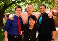 Graduates Elliot Wilder and Alex Roth of Hesston, Kan., Vincent Sorrells of Cedar Park, Texas, and Yohannes Setiadi of Banyuwangi, Indonesia pose for a photo after Hesston College Commencement May 8.