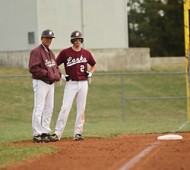 Spring 2010 - Baseball Coach Art Mullet chats with freshman Garrett Kurtz at third base while an opposing pitcher warms up.