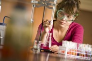 a student in the Hesston College chemistry lab