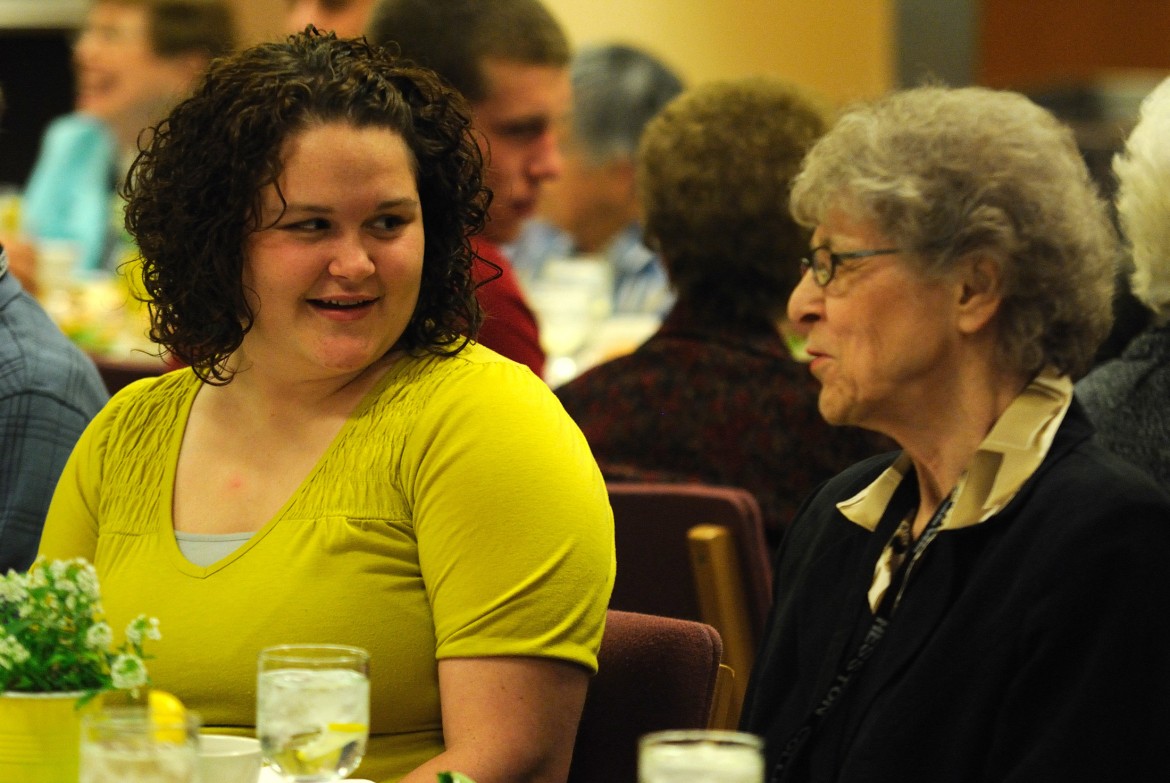 Hesston College freshman Courtney Mast talks with her grandmother Mari An Nyce, both of Weatherford, Okla., at the banquet in celebration of Grandparent Days March 24.