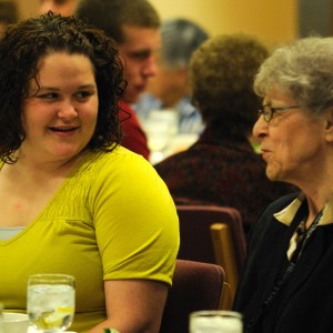 Hesston College freshman Courtney Mast talks with her grandmother Mari An Nyce, both of Weatherford, Okla., at the banquet in celebration of Grandparent Days March 24.