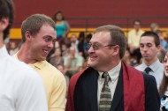 Alex Summy of Bristol, Ind., and James Wengerd of Hartville, Ohio, talk as they leave Yost Center following commencement exercises.