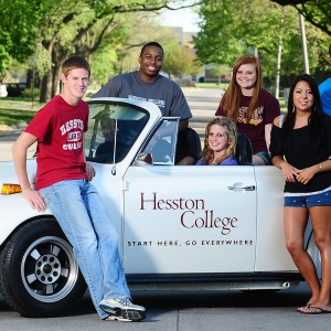 Hesston College students with the college's VW Super Beetle