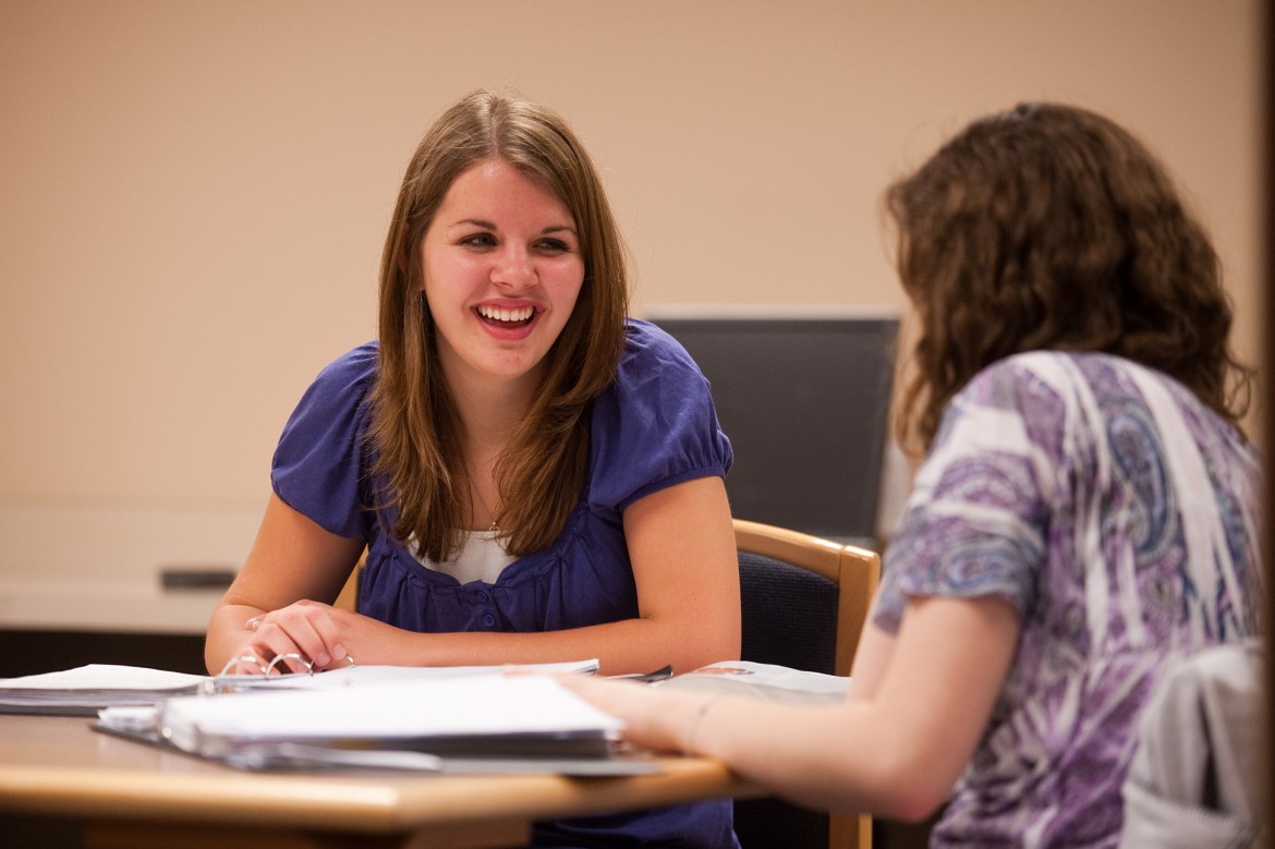 Erika Dorsch ’13 tutors a classmate in Microbiology.