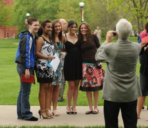 Students and graduates pose for a photo after commencement