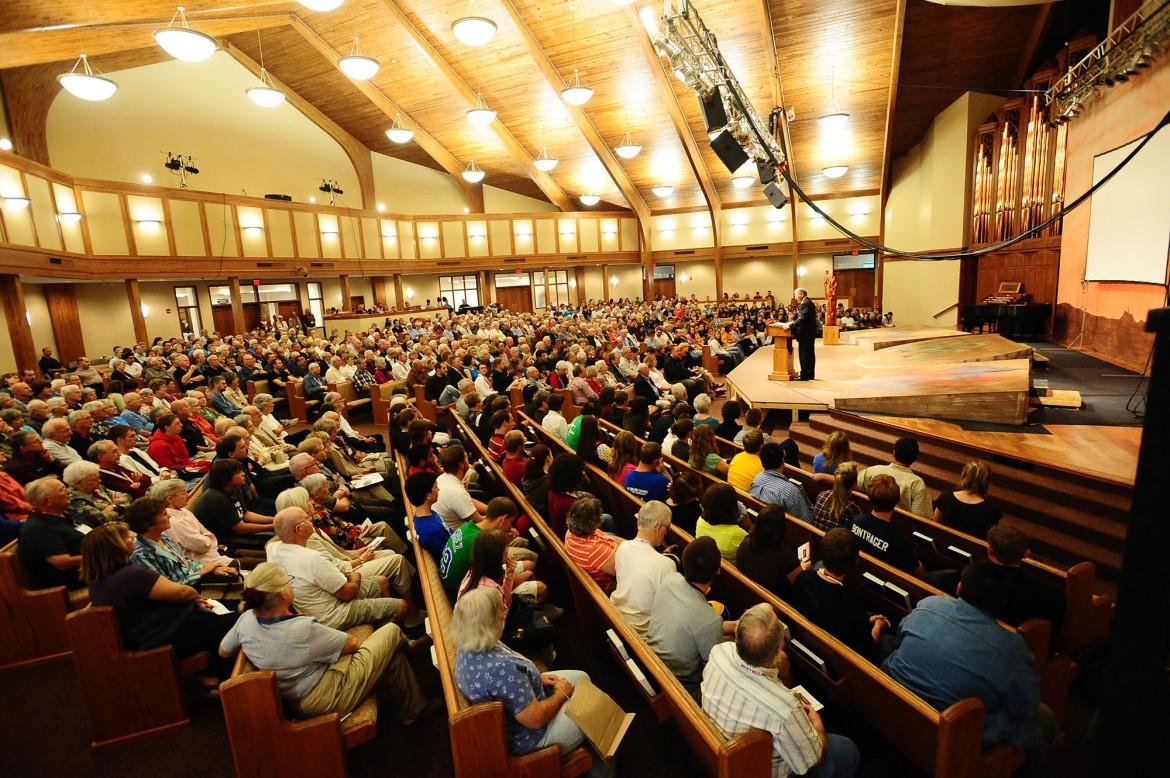 A crowd gathers in Hesston Mennonite Church for homecoming chapel