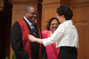 Larry Catlett ’11 receives his stole from Bible and Ministry faculty Michele (Schrock) ’81  Hershberger at Pastoral Ministries Commissioning May 7, as his wife, Carlotta Ponds, looks on.