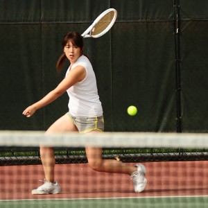 Hesston College women's tennis action photo