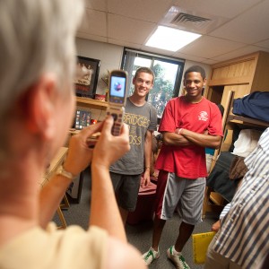 Freshmen roommates David Rudy (Manheim, Pa.) and Michel Anderson (Wichita, Kan.) pose for Rudy’s mother, Carolyn, as they moved in to Kauffman Court at the beginning of the year.