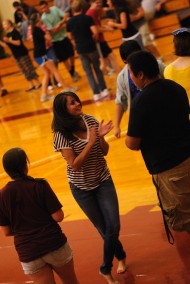 Resident Director, Lindsey Mason, encourages sophomore Andrew Penner (Fresno, Calif.) to join in the contra dance.