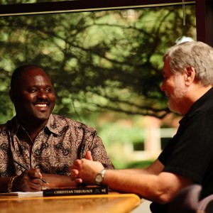 Ron Moyo discusses class concepts with Tim Lichti, Director of the Hesston College Pastoral Ministries program.