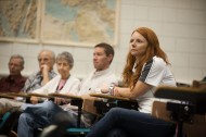 Heather Harkins ’12, an air traffic control student from Wichita, Kan., listens to a symposium presentation.