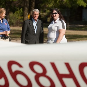 Amy Birdsell (right) talks with (from left) Dr. Sandra Zerger, vice president of Academics; Sandy Toews, Aviation staff; and former President Laban Peachey during Homecoming 2011.