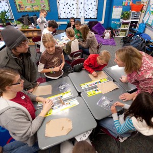 Hesston College Environmental Biology students work with Hesston Elementary third graders.