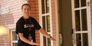Hesston College freshman Pierre Zook leads a campus tour.