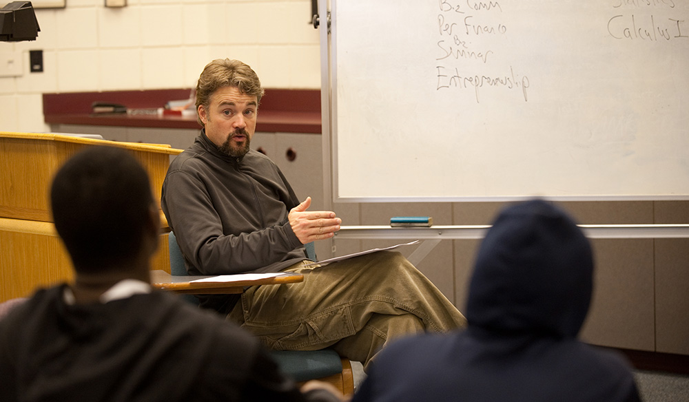 David LeVan talks with a group of his first-year advisees about planning their courses.