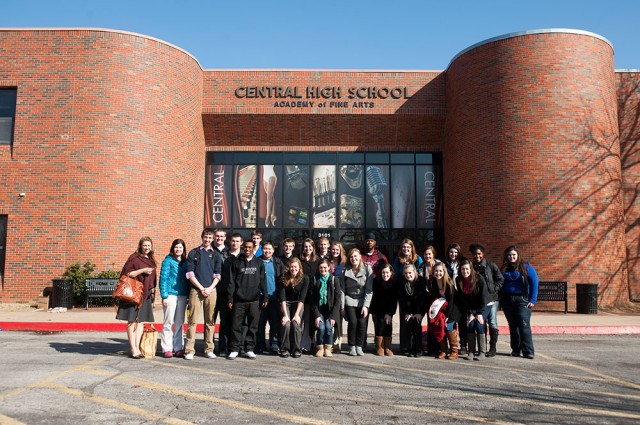 The Hesston College group poses outside Tulsa Central Junior High and High School after their day of observing and working with students.