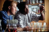 Muzi Ncube ’91, right, participates in a lab while a student in the early 1990s. He is now a pharmacist in Indianapolis. Photo by Jay Thomas.