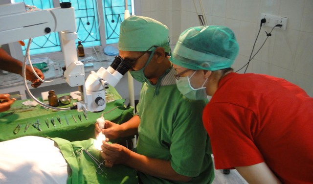 Grace Schmidt (Wichita, Kan.) watches a cataract surgery at Menno Clinic India. The surgeries were 15 to 20 minute procedures performed with local anesthesia and, at times, by the light of only a flashlight as electricity was unpredictable.