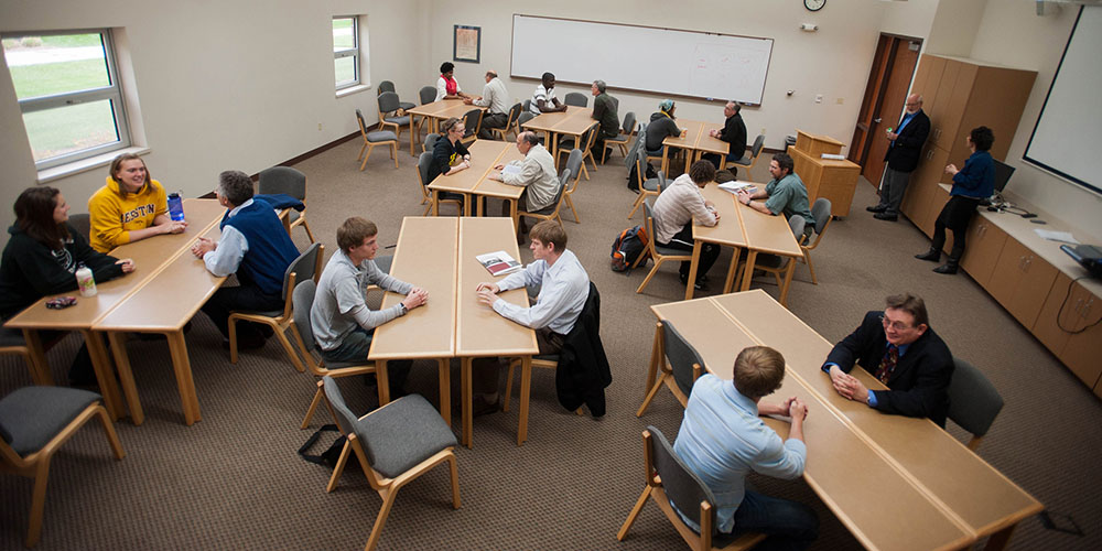 Hesston College students share their experiences with Hesston College Bible classes with Bible teachers from nine Mennonite high schools April 12.