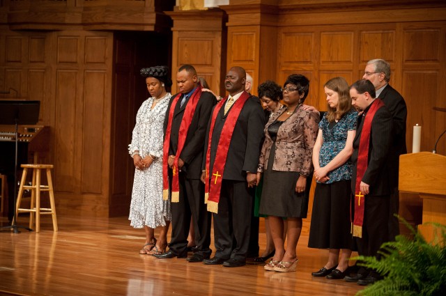 Hesston College Pastoral Ministries graduates and their wives receive a prayer of blessing