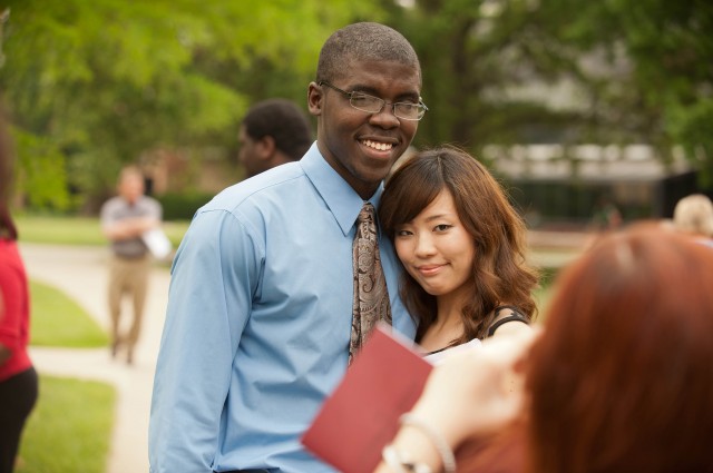 Hesston College graduates Aaron Jones (Kansas City, Mo.) and Saki Nozaki (Tokyo, Japan) pose for a picture following commencement May 6.