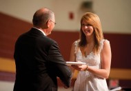 Kate Steury (New Paris, Ind.) receives her diploma from President Keim.