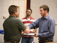 Josh Musser (Newport News, Va.) receives recognition of completion from Disaster Management Program Director Russ Gaeddert.