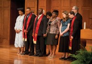 Pastoral Ministries graduates and their wives receive a prayer of blessing from Bible and Ministry faculty and staff.