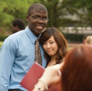 Hesston College graduates Aaron Jones (Kansas City, Mo.) and Saki Nozaki (Tokyo, Japan) pose for a picture following commencement May 6.