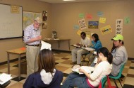 Al Yoder with students in his English as a Second Language classroom