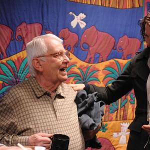Bill Mason (center), longtime Hesston College employee, is congratulated by Melissa Unruh (left) and Rachel Swartzendruber Miller (right) during Mason’s retirement celebration at Hesston College Feb. 16.