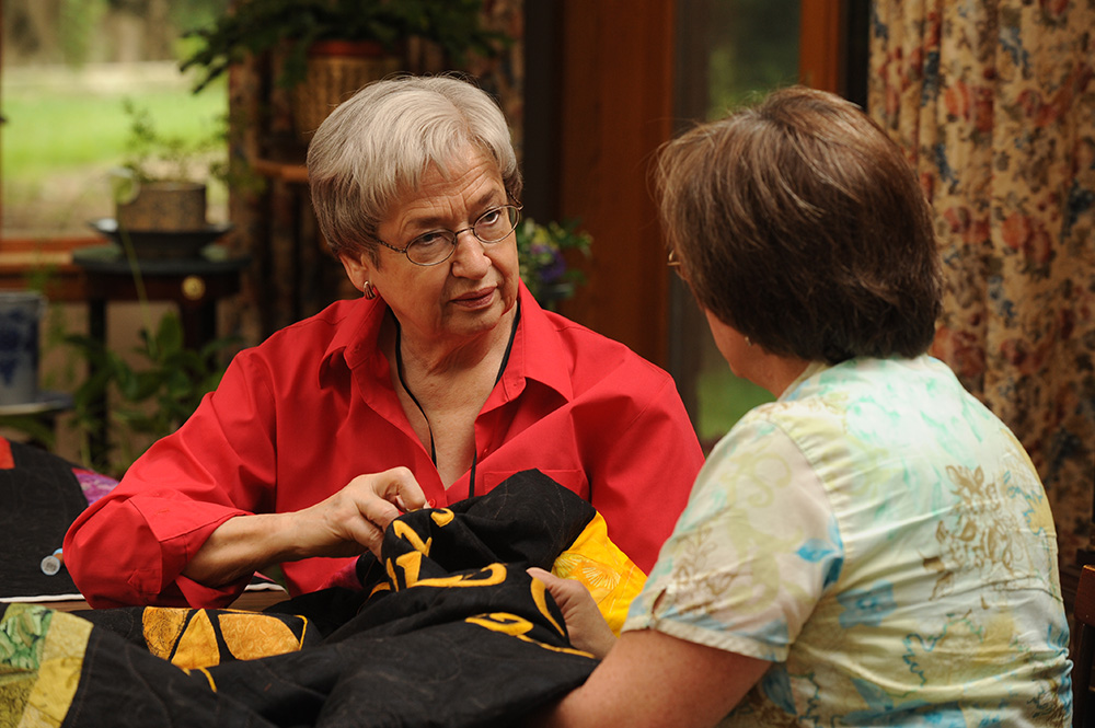 Martha Hershberger and Faith Penner, a mother-daughter team, work on the Hesston College Centennial Quilt. The quilt will be unveiled following a Friday evening, Sept. 25 performance of Quilters.