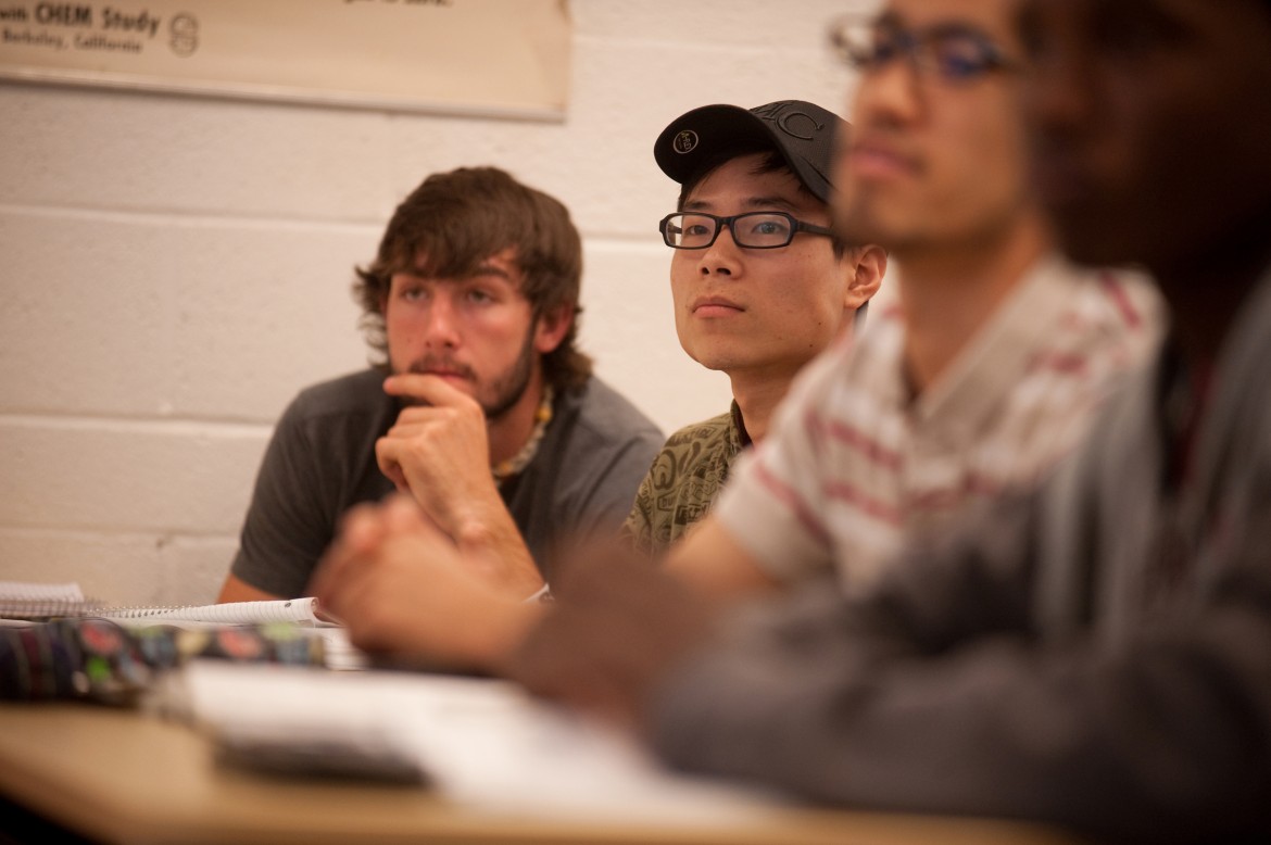 Luke Ropp (Inman, Kan.) and Weihao Kong (Hefei, China) listen to precalculus instructor Jeff Baumgartner explain a concept during the spring 2012 semester.