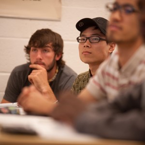 Luke Ropp (Inman, Kan.) and Weihao Kong (Hefei, China) listen to precalculus instructor Jeff Baumgartner explain a concept during the spring 2012 semester.