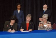 Dr. Sandra Zerger, Vice President of Academics at Hesston College, and Dean of the University of Kansas School of Nursing, Karen Miller, RN, Ph.D., FAAN, sign an articulation agreement for nurses.