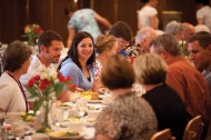 Zach ’02 and Mary (Wittmer) ’02 Kooker visit with other Partners at the Saturday Partner luncheon.