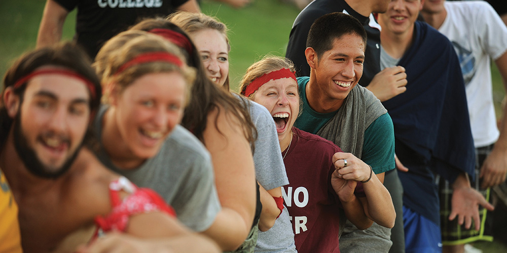 Students participate in the lap sit during the annual Opening Weekend Mod Olympics.