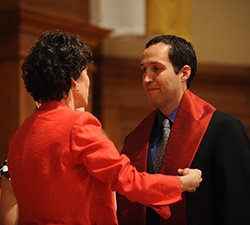 Pastoral Ministries graduate Shawn Nolt receives his stole from Bible and Ministry faculty member Michele Hershberger